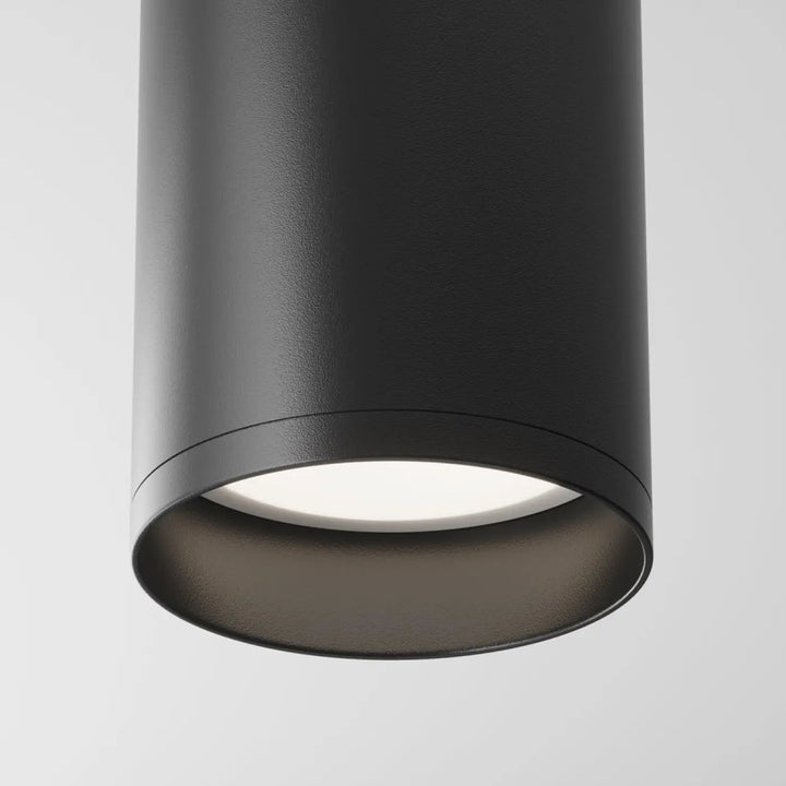 Spot focus cylindre black cylindrical ceiling light with matte finish and illuminated ampoule gu10 panel