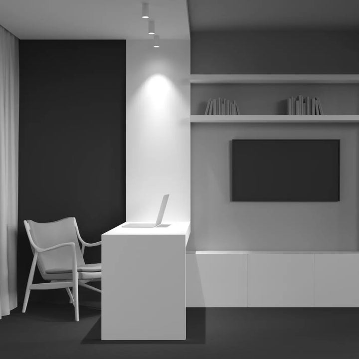 Bureau blanc minimaliste spot focus compact avec lignes épurées et lumière dirigée pour petit cylindre