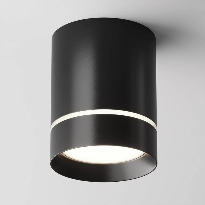 Spot orlo cylindre compact en acier noir avec finition mate et anneau lumineux blanc pour éclairage plafond moderne