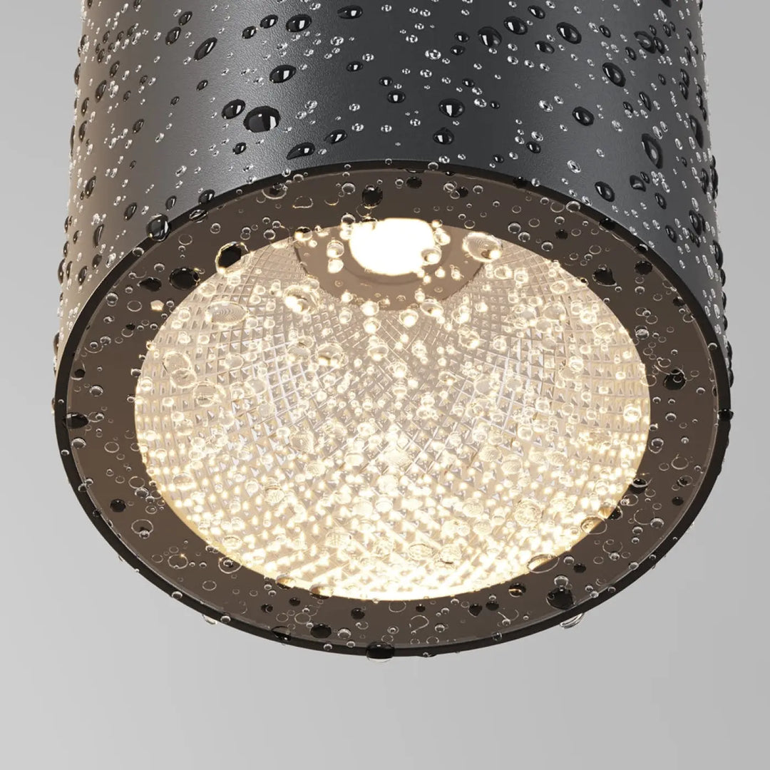 Spot roll cylindre noir en acier noir avec diffuseur en verre dépoli et boîtier métallique perforé pour éclairage chaud plafond