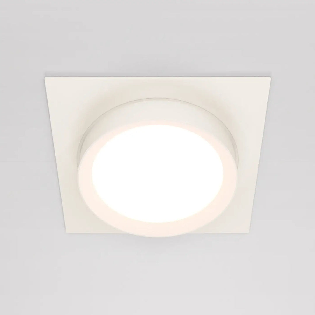 Spot semi encastré cadre carré blanc avec disque lumineux circulaire au centre doux et éclairé pour plafond