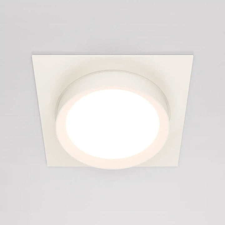 Spot semi encastré cadre carré blanc avec disque lumineux circulaire au centre doux et éclairé pour plafond