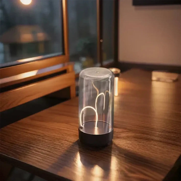 Lampe de table led supprimer cylindrique avec corps en verre transparent et filament flexible éclairant pour les working days