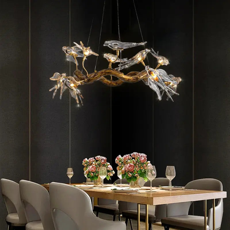 Suspension design branche dorée avec oiseaux en verre