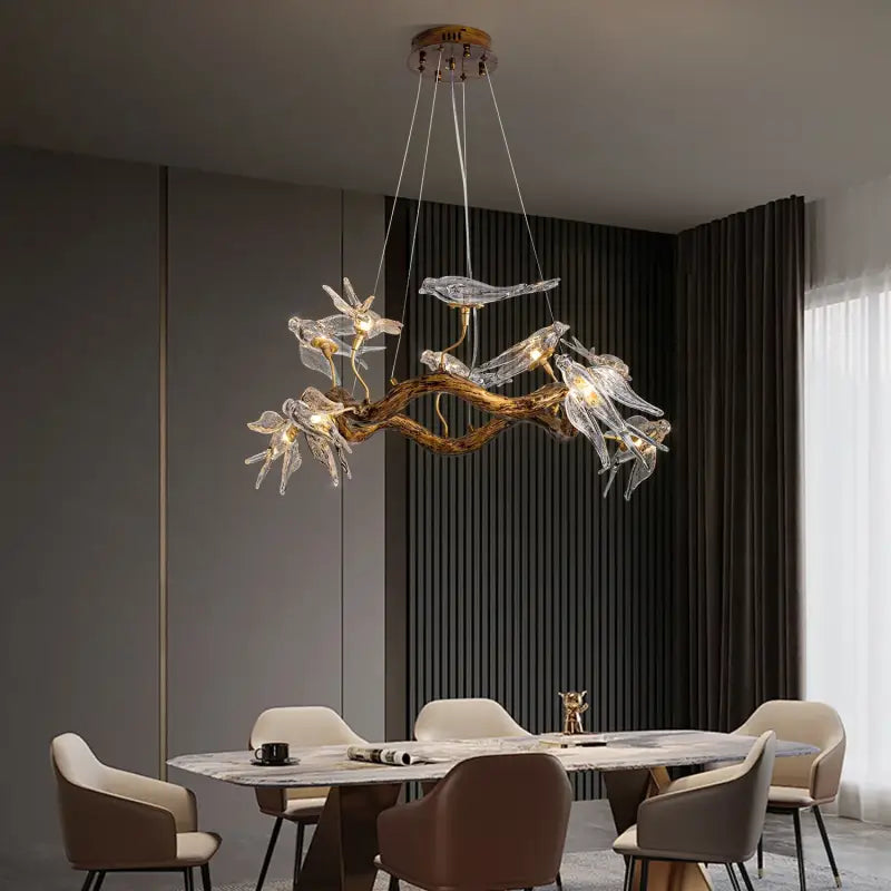 Suspension design branche dorée avec oiseaux en verre