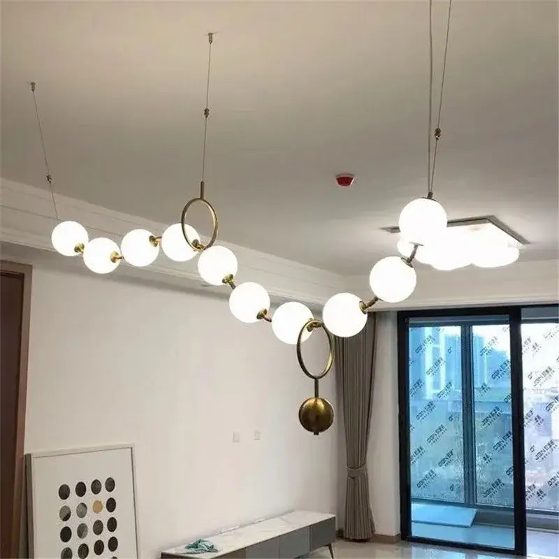 Suspension moderne boules lumineuses doré blanc raffiné