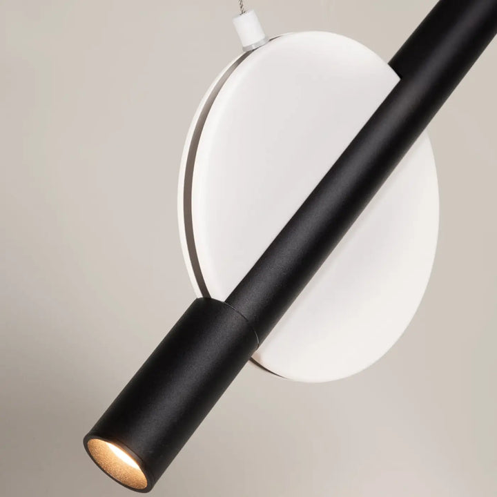 Suspension enigma cylindre en aluminium mat noir avec fixation circulaire blanche et orientation réglable à led chaude