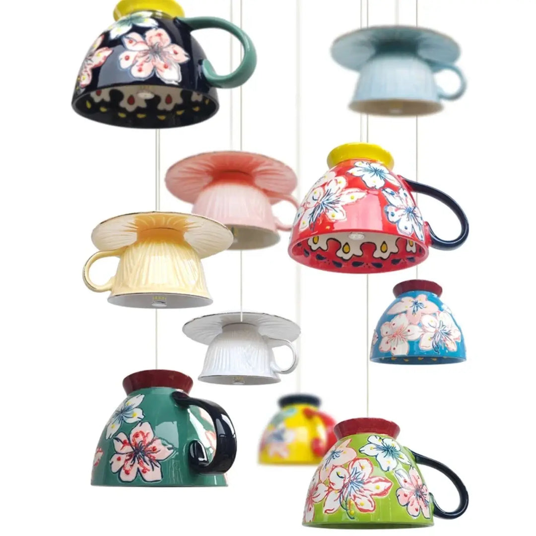 Suspension luminaire elancia avec collection de tasses style minimaliste en céramique colorée à motifs floraux