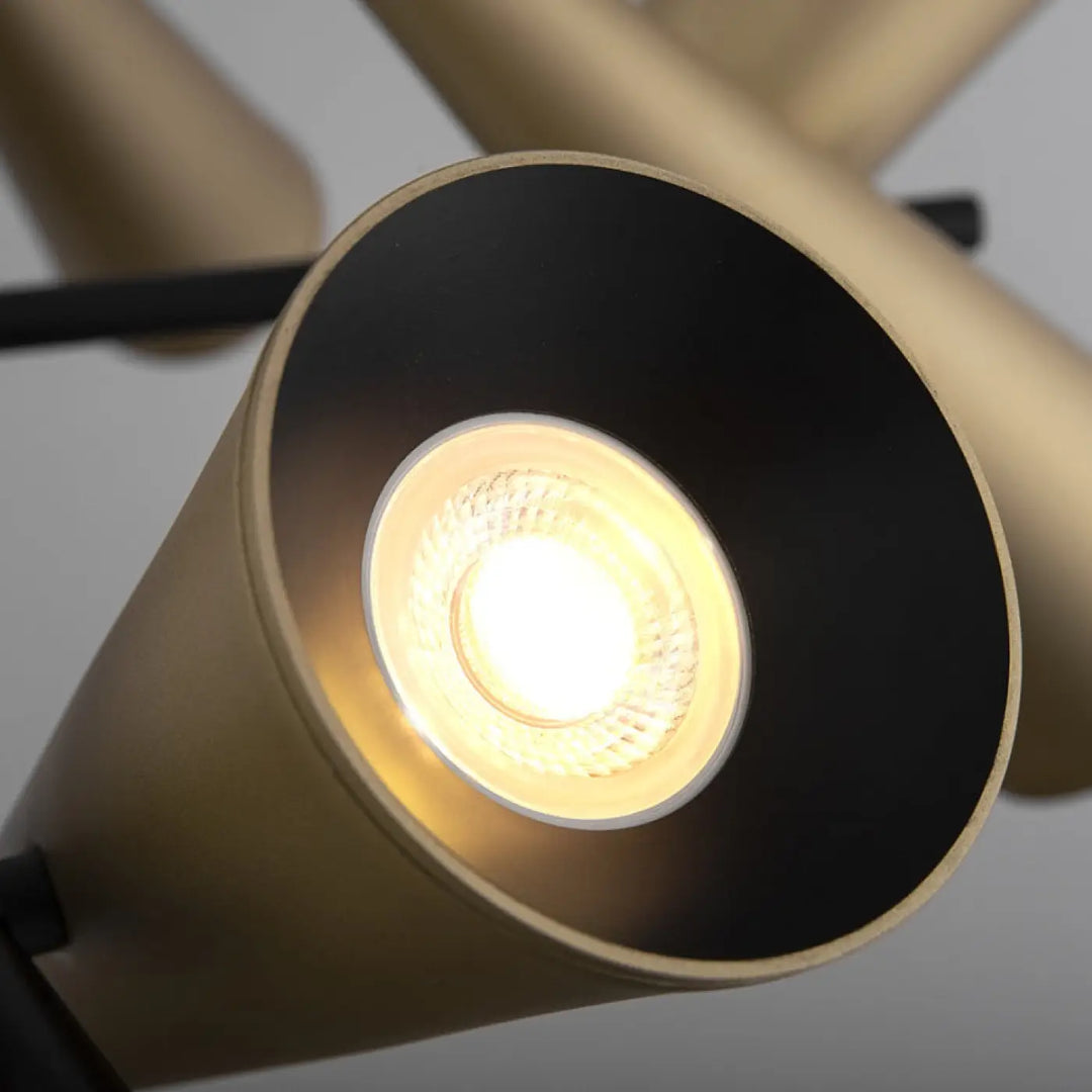 Suspension giro cylindrique en acier doré avec projecteurs orientables noire et ampoule led éclairée