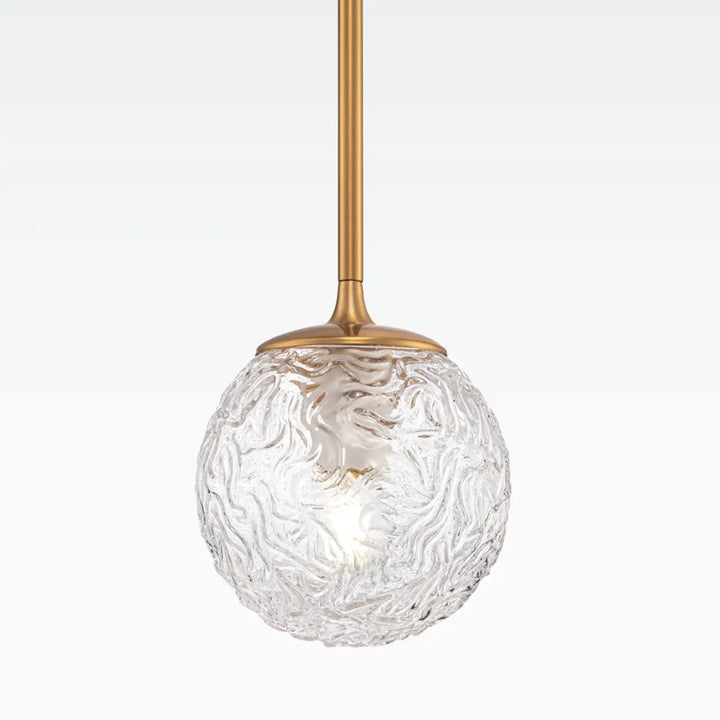 Suspension luminaire ligéro avec globe en verre transparent texturé et monture dorée style art déco