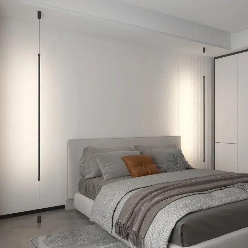 Suspension luminaire attachée au plafond au sol par une barre LED

