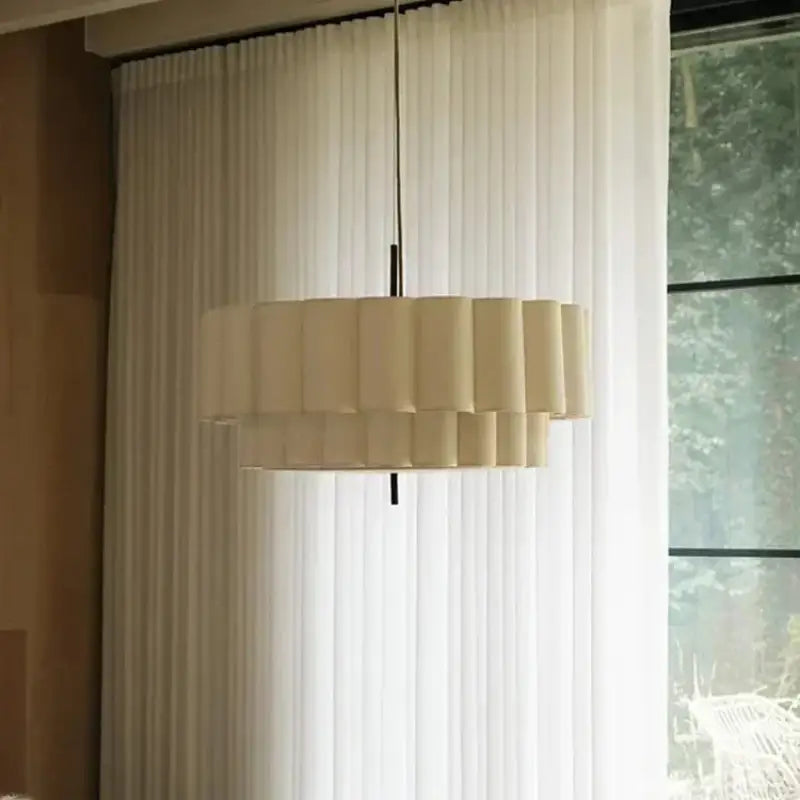 Suspension luminaire blanc crème en forme de cannelé moderne

