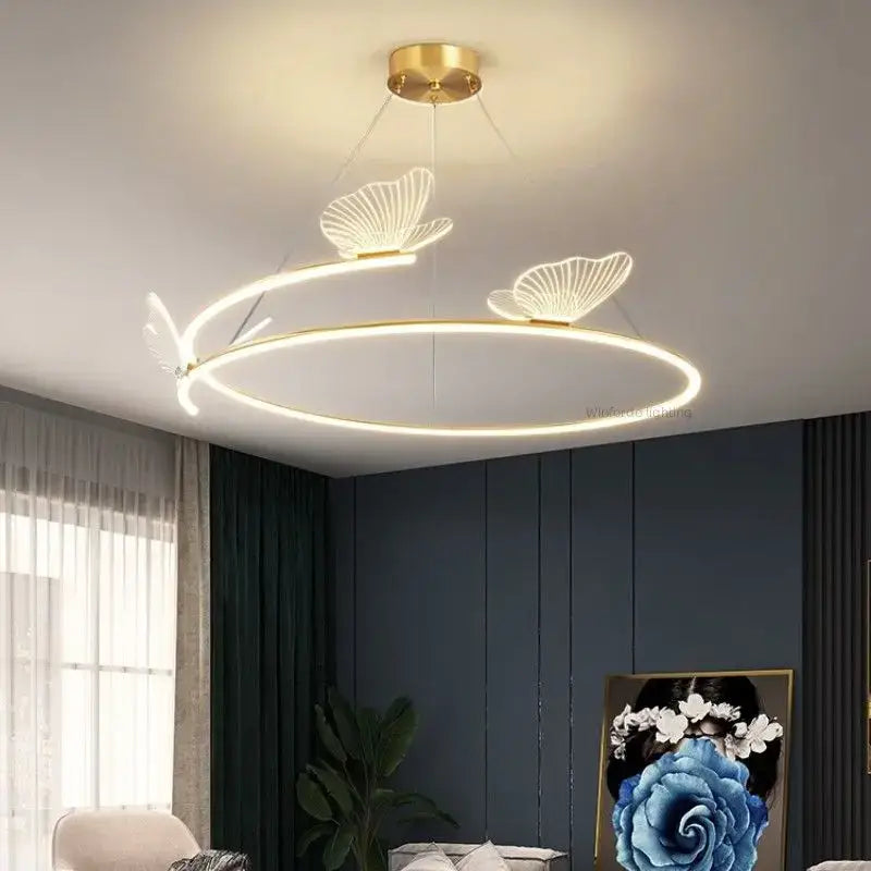 Suspension luminaire circulaire LED avec 3 papillons dorés

