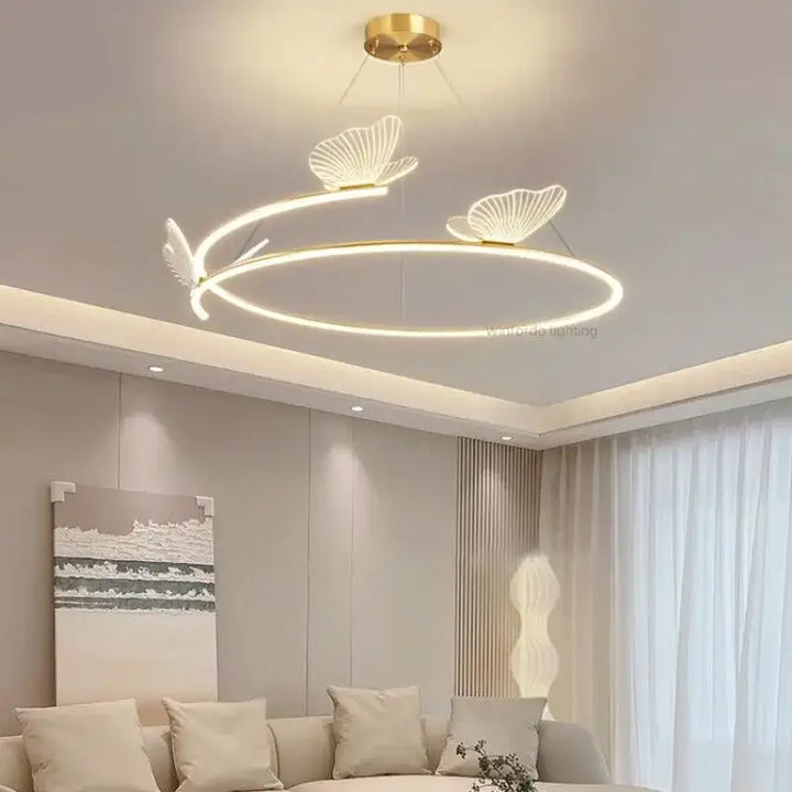 Suspension luminaire circulaire LED avec 3 papillons dorés

