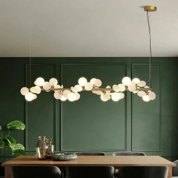 Suspension luminaire orbellia en métal doré avec ampoule incluse et sphères en verre blanc gris pour salle à manger