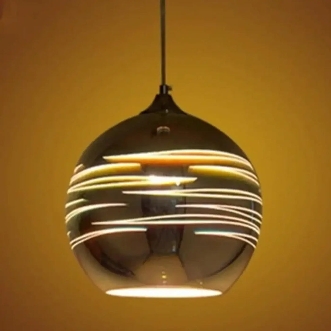 Suspension luminaire rizon en verre fumé sphérique aux reflets lumineux dorés concentriques