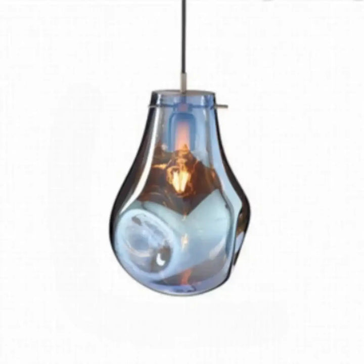 Suspension luminaire vulco en verre bleu translucide en forme de goutte avec des tourbillons subtils internes