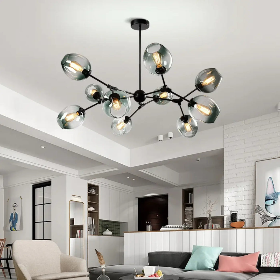 Suspension luminaire alloy en métal noir moderne avec bras articulés vintage et globes en verre givré abritant des ampoules filament