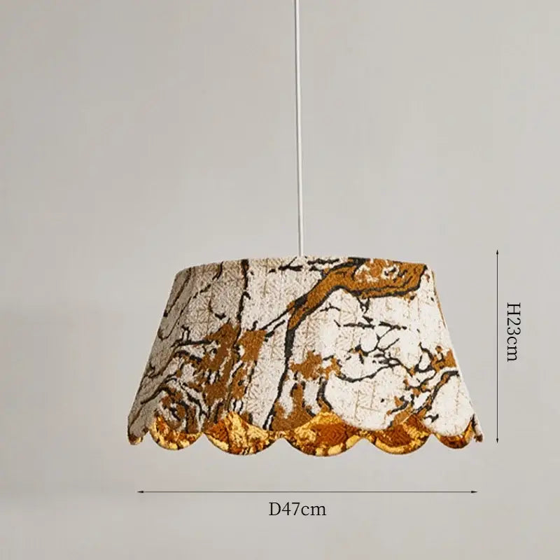 Suspension luminaire en tissu brodé motifs dorés élégants