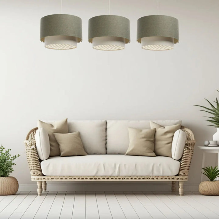 Three identical cylindrical suspension luminaire duo rattan with textured gray fabric shades and white perforated rings