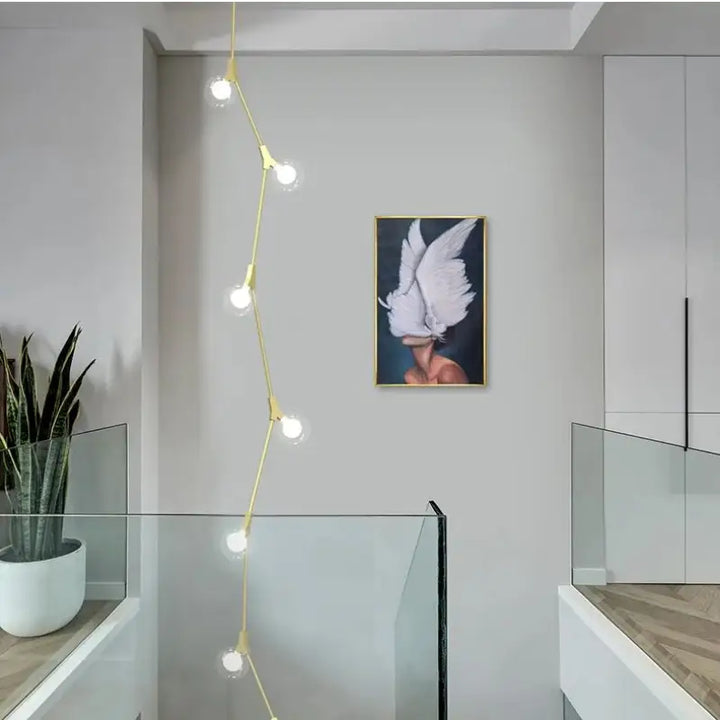 Suspension luminaire verticale en boules opales et laiton