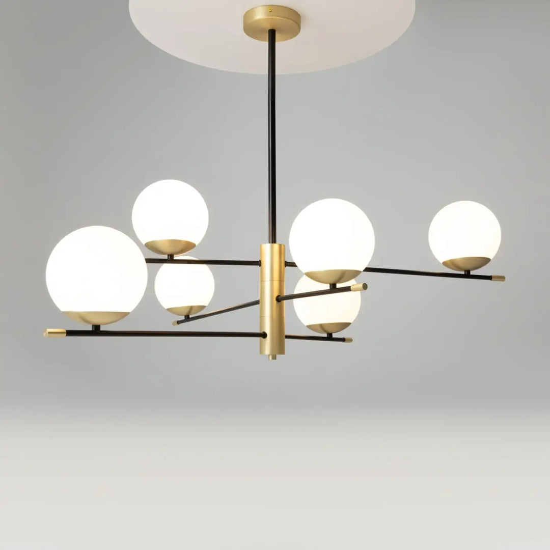 Suspension luminaire nostalgia en acier noir avec six globes en verre dépoli et finition dorée élégante