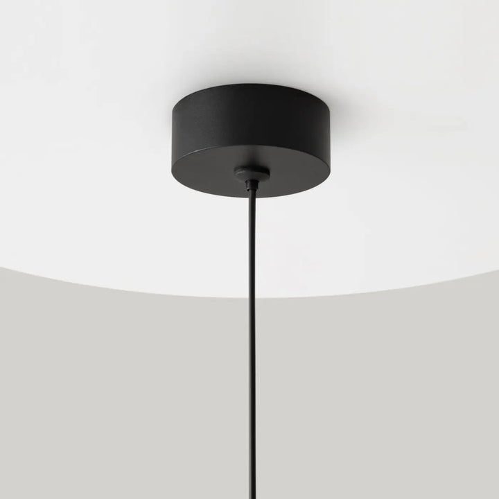 Suspension luminaire petit disque polar noir cylindrique avec design minimaliste pour plafond moderne