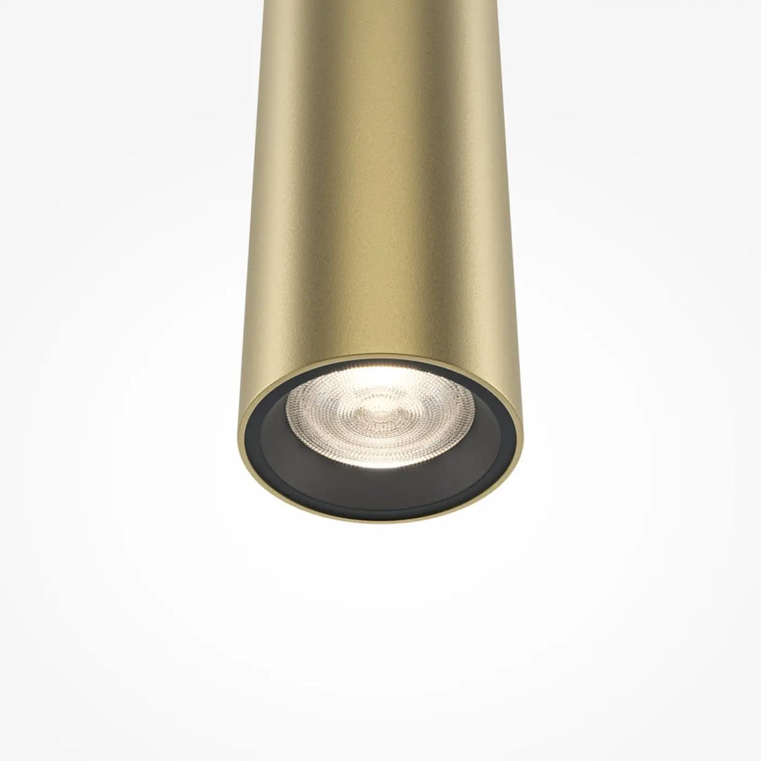 Suspension pro tube lumineux en métal doré avec finition cylindrique noir au-dessus d’un led intégré