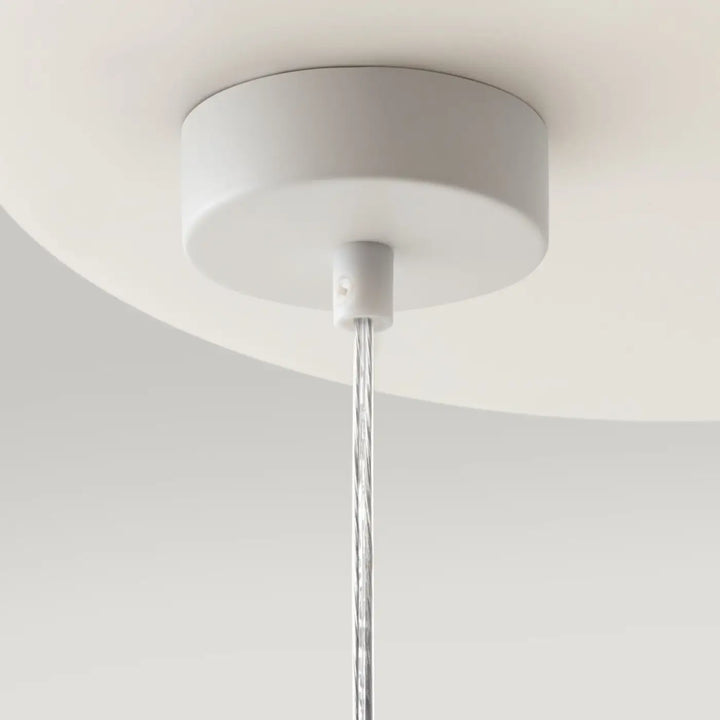 Plafonnier suspension ring blanc avec design minimaliste et câble transparent pour une touche art déco élégante