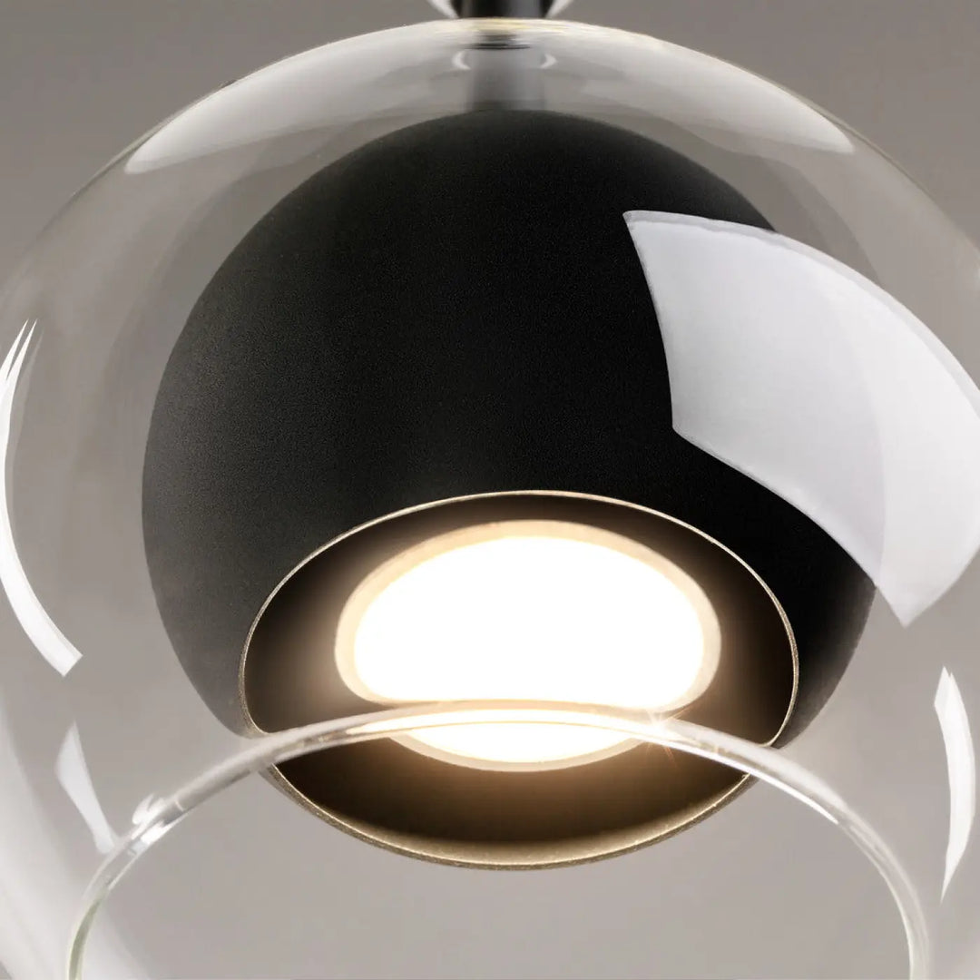 Suspension ros diffuseur vertical avec globe en verre transparent et culot gu10 noir et blanc éclairé au centre
