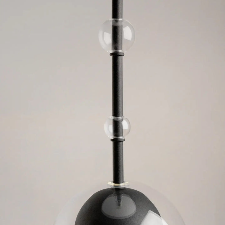 Suspension ros diffuseur vertical avec culot gu10 en verre clair et sphères noires sur tige noire élégante
