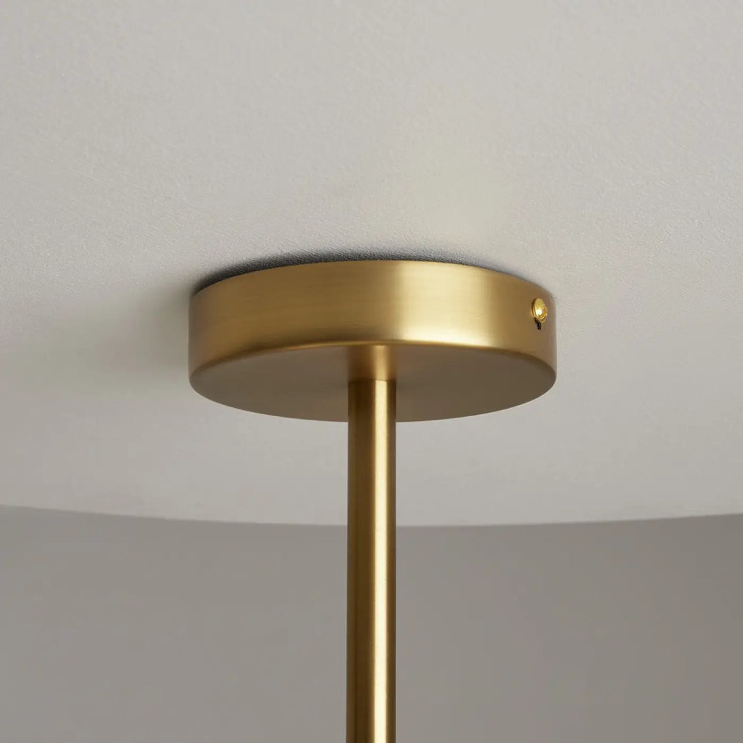 Suspension tropic métal doré avec plaque circulaire et tige verticale slender design art déco